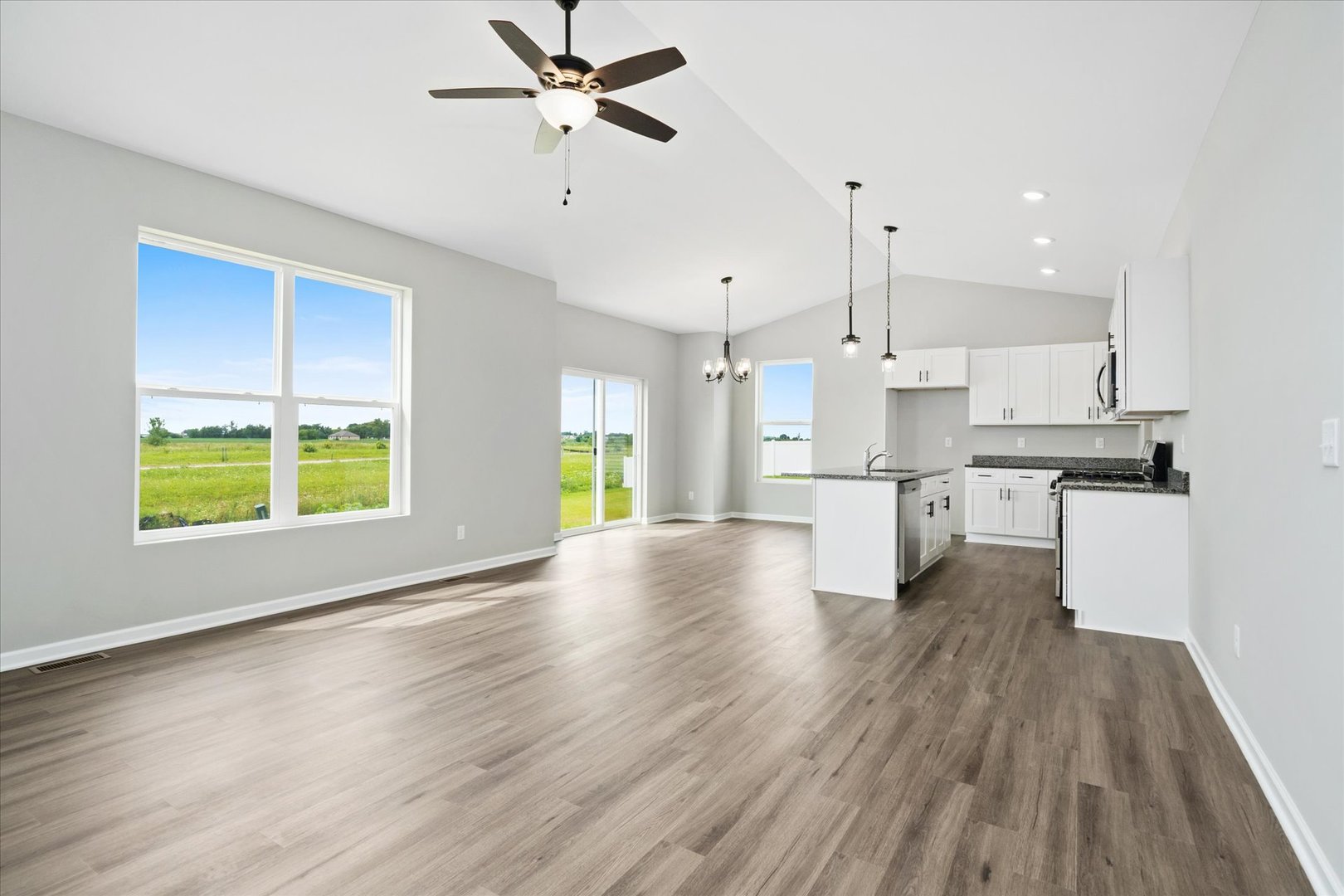 427 Riverbend Drive Genoa, IL 60135 - Photo 7 of 31 a view of kitchen with stainless steel appliances refrigerator wooden floor and window