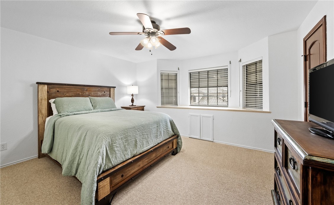 15330 Key Largo Court Corpus Christi, TX 78418 - Photo 15 of 33 a bedroom with a bed dresser and a flat tv screen