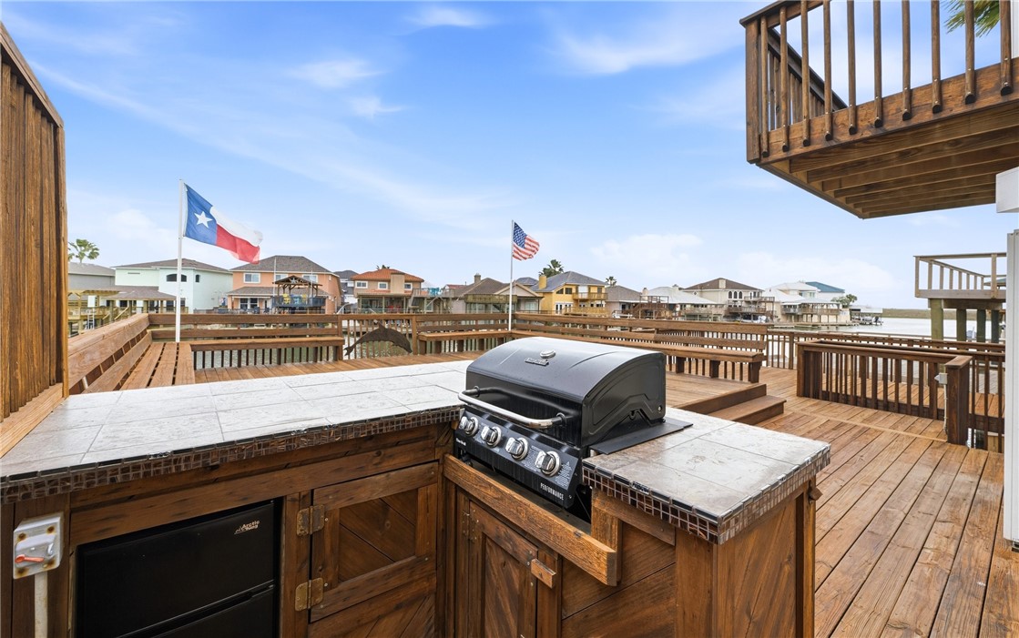 15330 Key Largo Court Corpus Christi, TX 78418 - Photo 23 of 33 a roof deck with stove and white cabinets