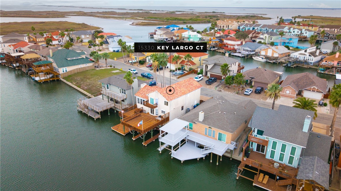 15330 Key Largo Court Corpus Christi, TX 78418 - Photo 32 of 33 an aerial view of a house with outdoor space swimming pool and ocean view