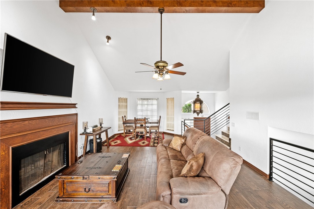 15330 Key Largo Court Corpus Christi, TX 78418 - Photo 6 of 33 a living room with furniture a flat screen tv and a fireplace