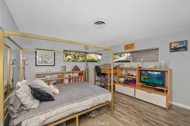 a bedroom with furniture and window