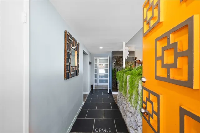 a view of a patio with couches chairs and a fire pit