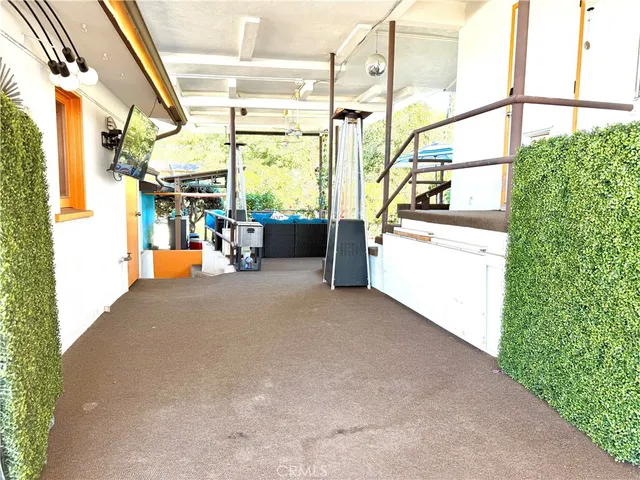an aerial view of residential houses with city and ocean view