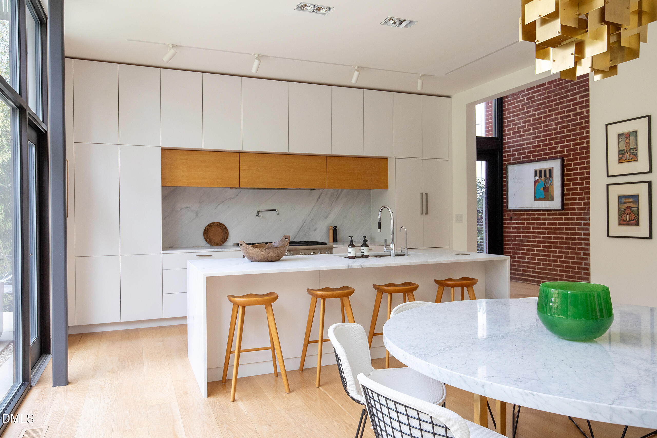 117 Hillcrest Road Raleigh, NC 27605 - Photo 11 of 80 a kitchen with a table a stove and white cabinets