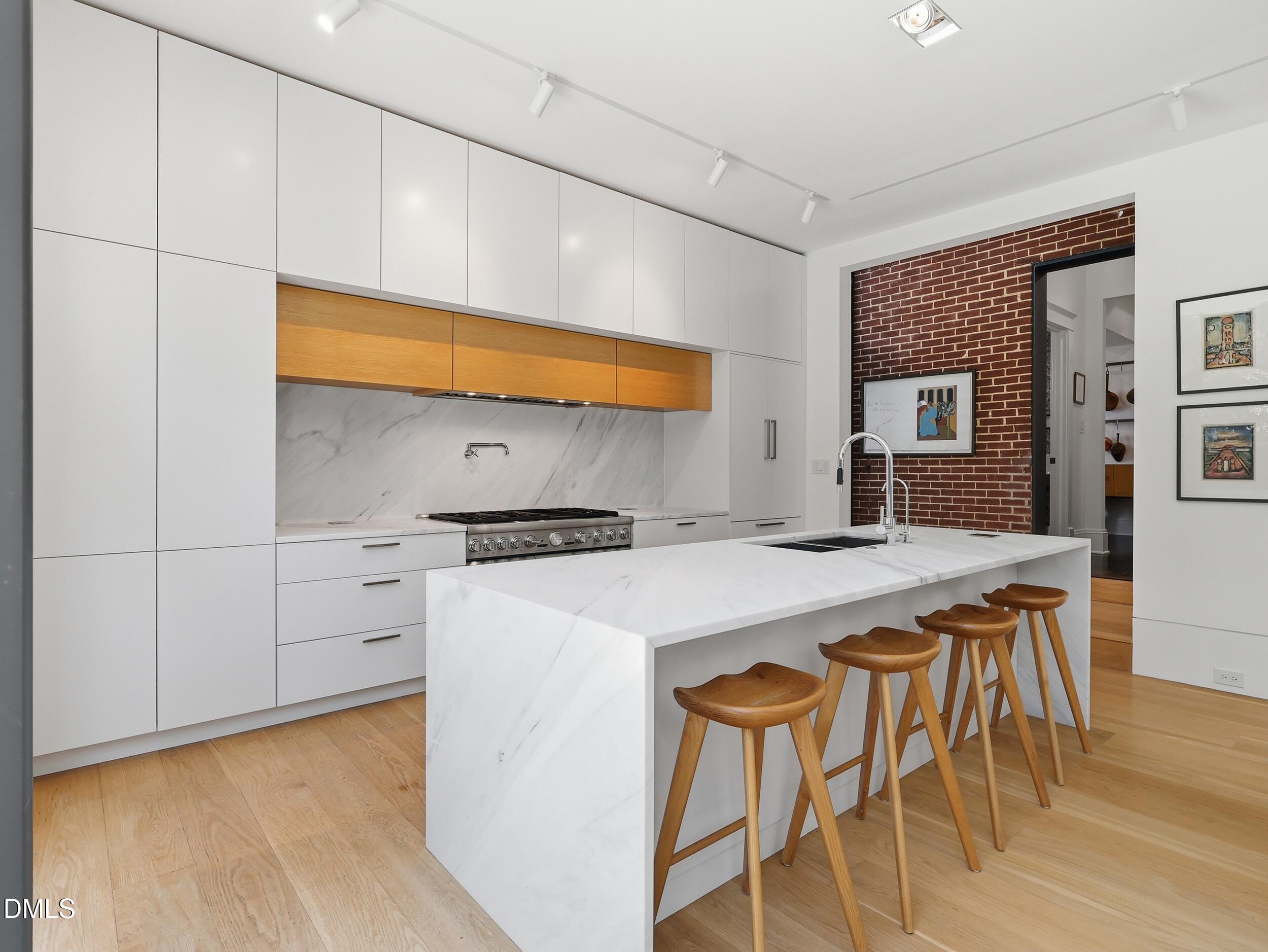 117 Hillcrest Road Raleigh, NC 27605 - Photo 14 of 80 a kitchen with stainless steel appliances a stove a sink and a refrigerator