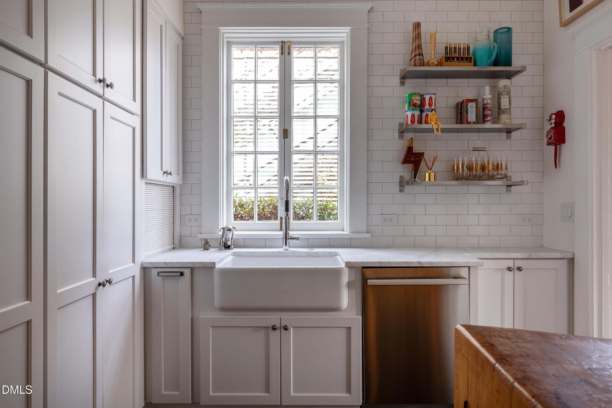 117 Hillcrest Road Raleigh, NC 27605 - Photo 20 of 80 a kitchen with a sink cabinets and a window
