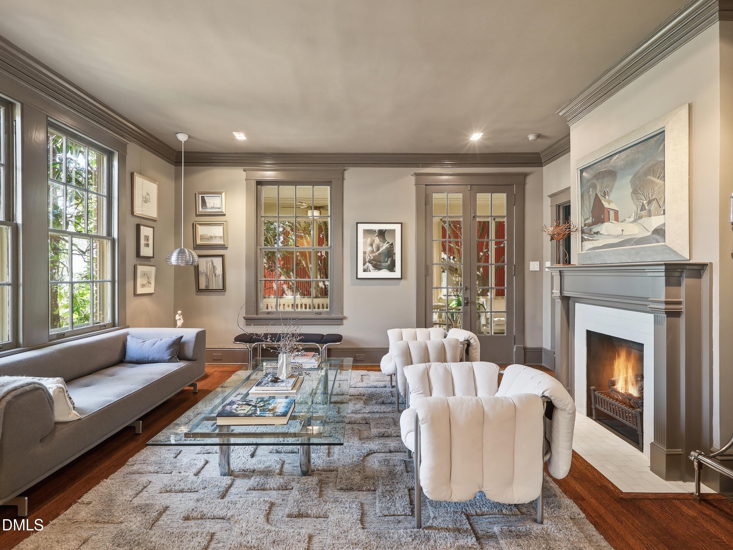 117 Hillcrest Road Raleigh, NC 27605 - Photo 24 of 80 a living room with furniture fireplace and large windows