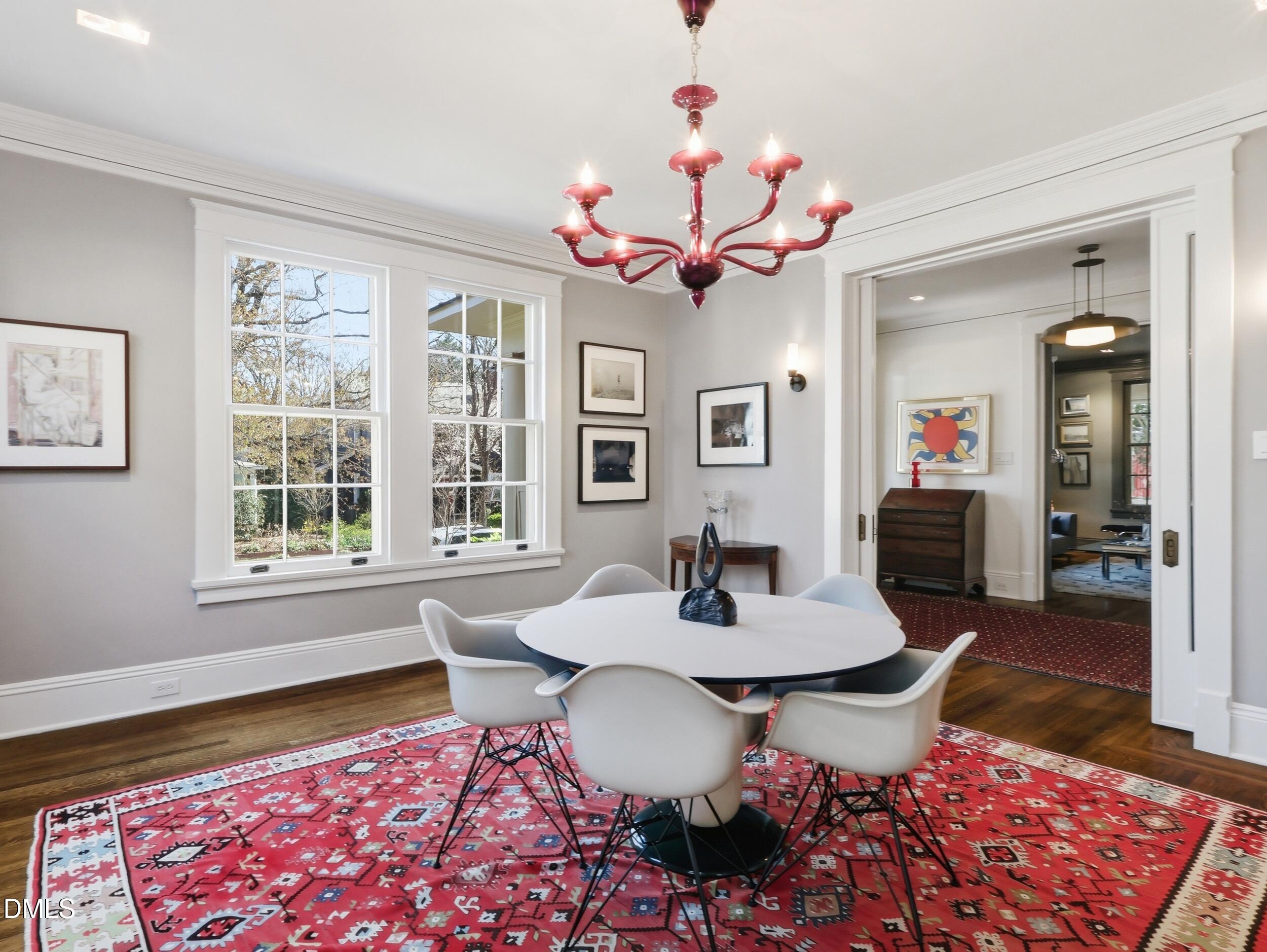 117 Hillcrest Road Raleigh, NC 27605 - Photo 26 of 80 a dining room with wooden floor and chandelier