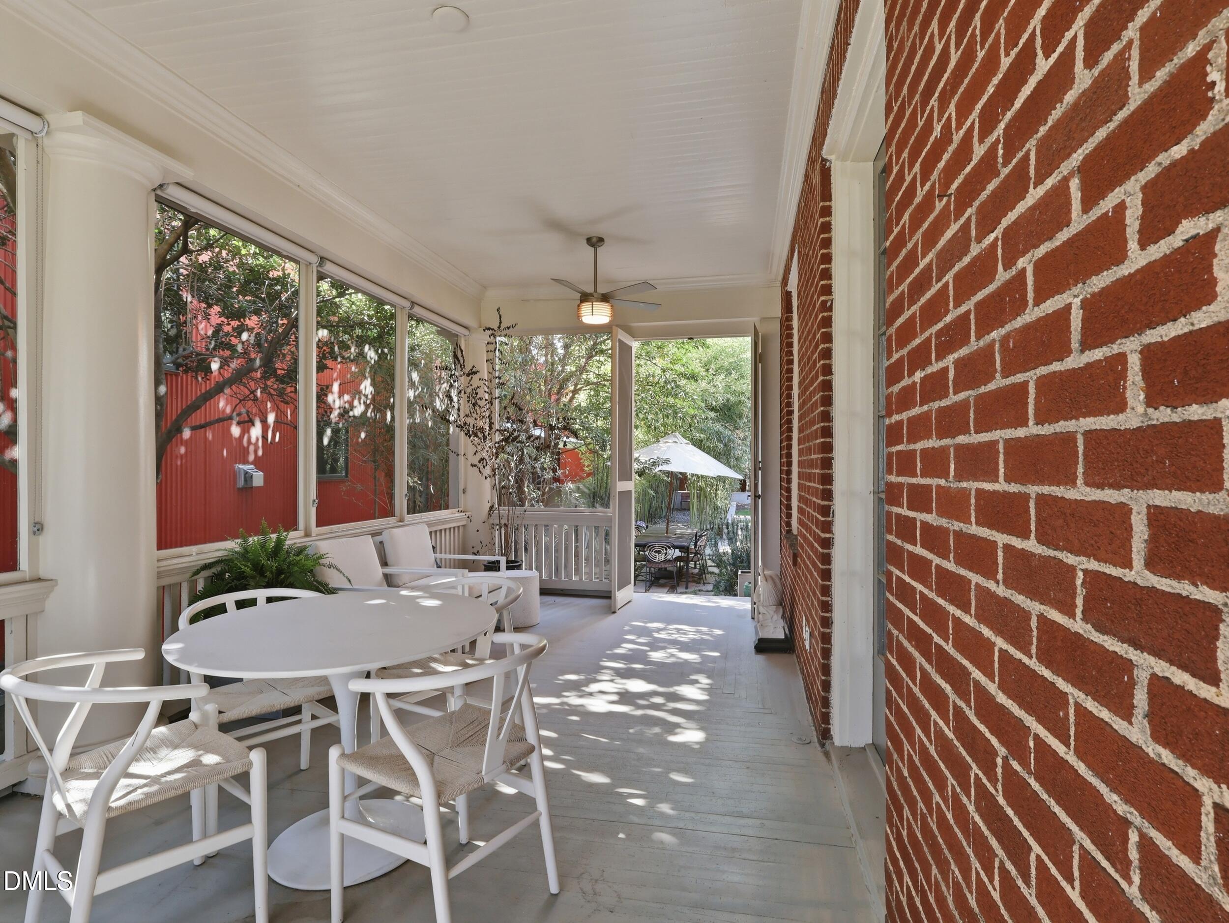 117 Hillcrest Road Raleigh, NC 27605 - Photo 29 of 80 a view of a dining room with furniture and chandelier