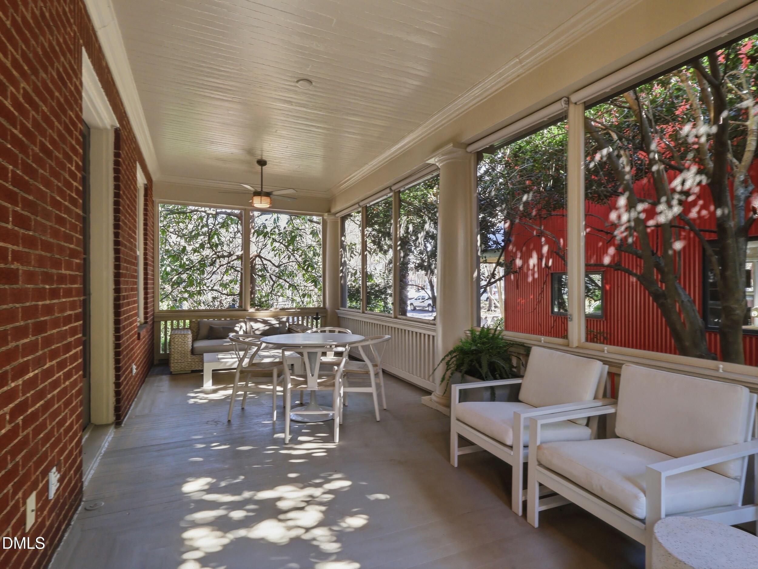 117 Hillcrest Road Raleigh, NC 27605 - Photo 30 of 80 a living room with furniture and a large window