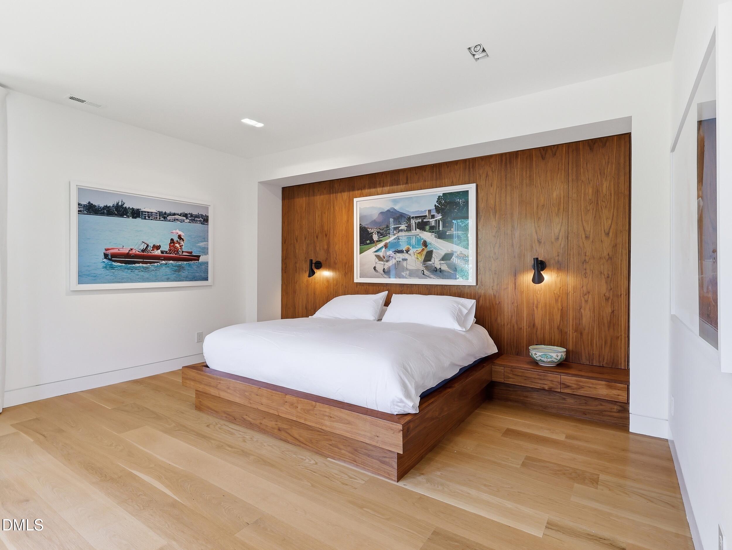 117 Hillcrest Road Raleigh, NC 27605 - Photo 36 of 80 a bedroom with a large bed painting on the wall and a window