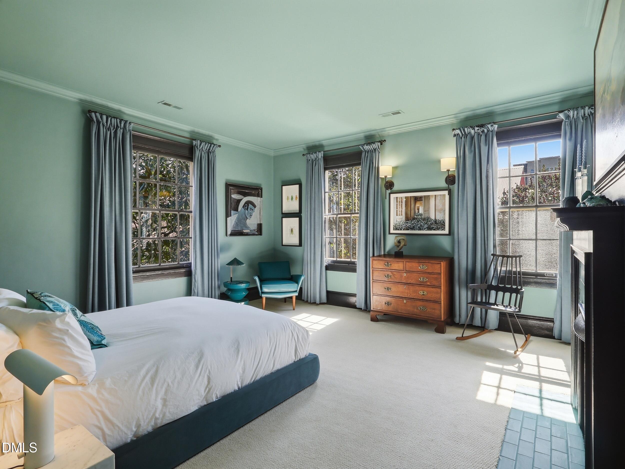 117 Hillcrest Road Raleigh, NC 27605 - Photo 46 of 80 a spacious bedroom with a bed and large window