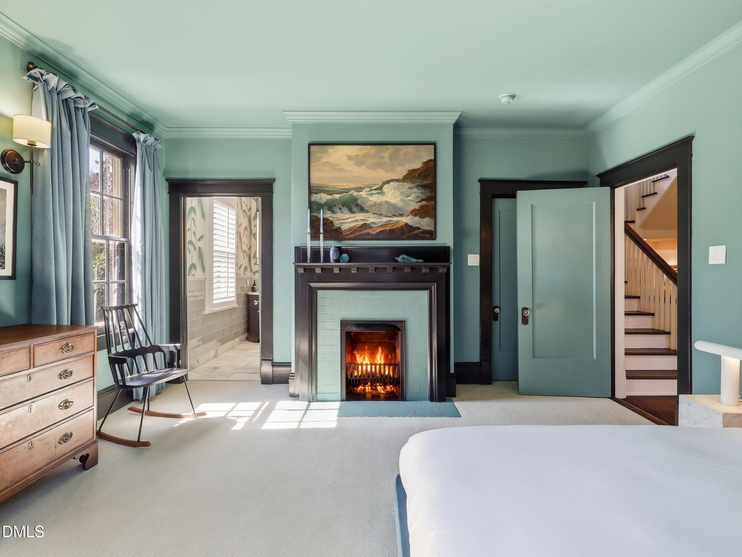 117 Hillcrest Road Raleigh, NC 27605 - Photo 47 of 80 a bedroom with a bed and a fireplace