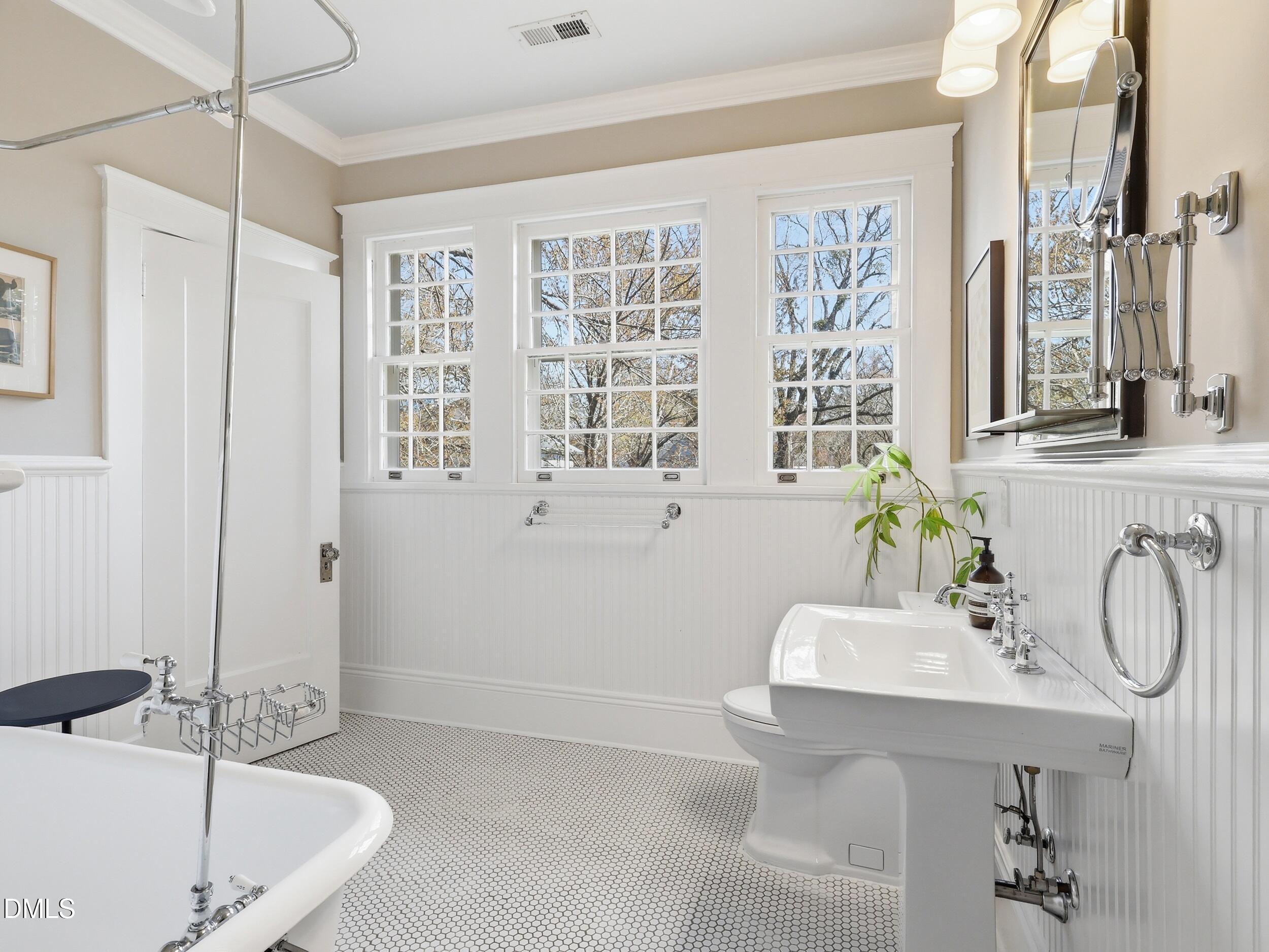 117 Hillcrest Road Raleigh, NC 27605 - Photo 51 of 80 a bathroom with a tub sink and mirror