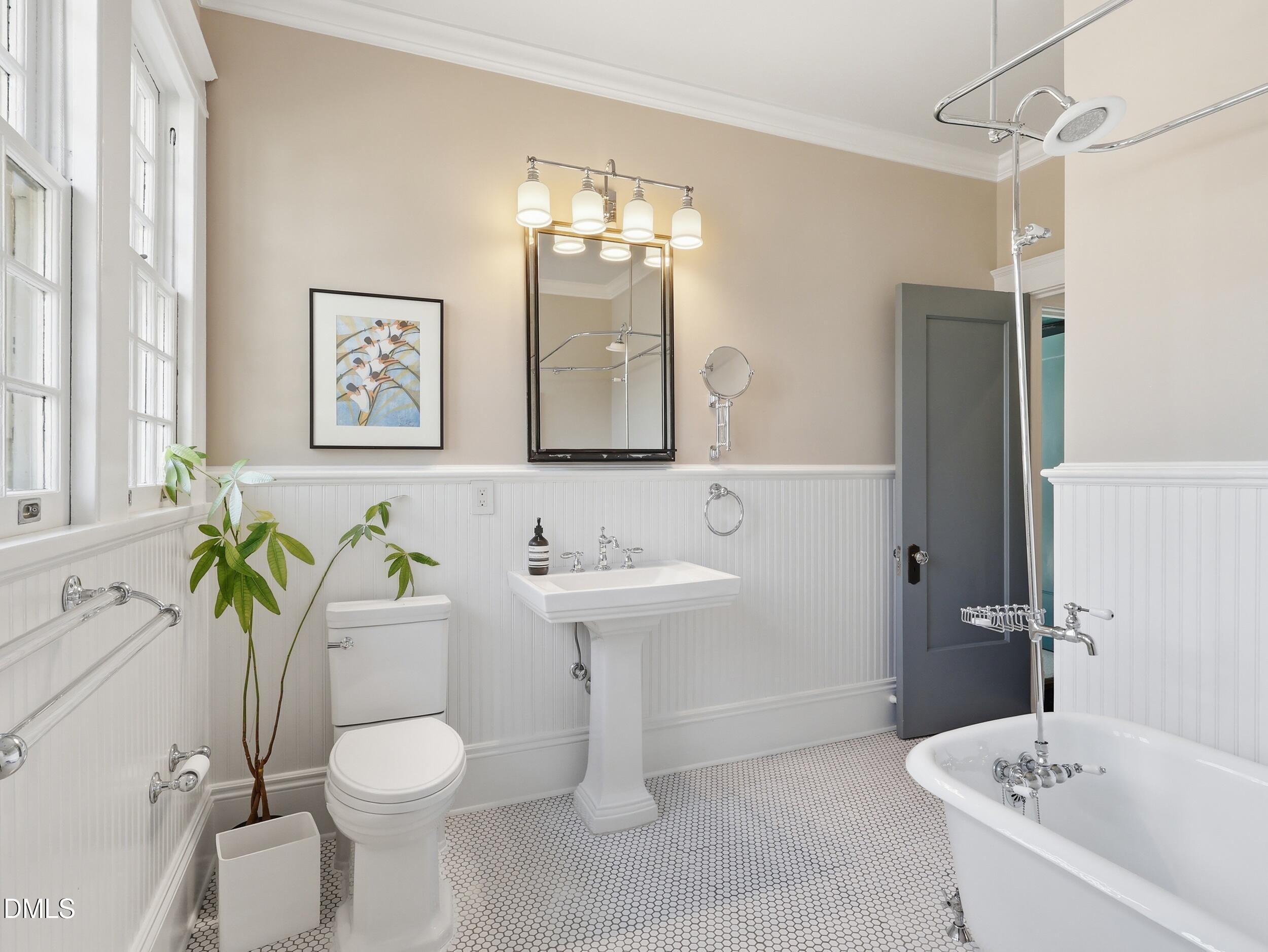 117 Hillcrest Road Raleigh, NC 27605 - Photo 52 of 80 a bathroom with a sink a toilet and bathtub