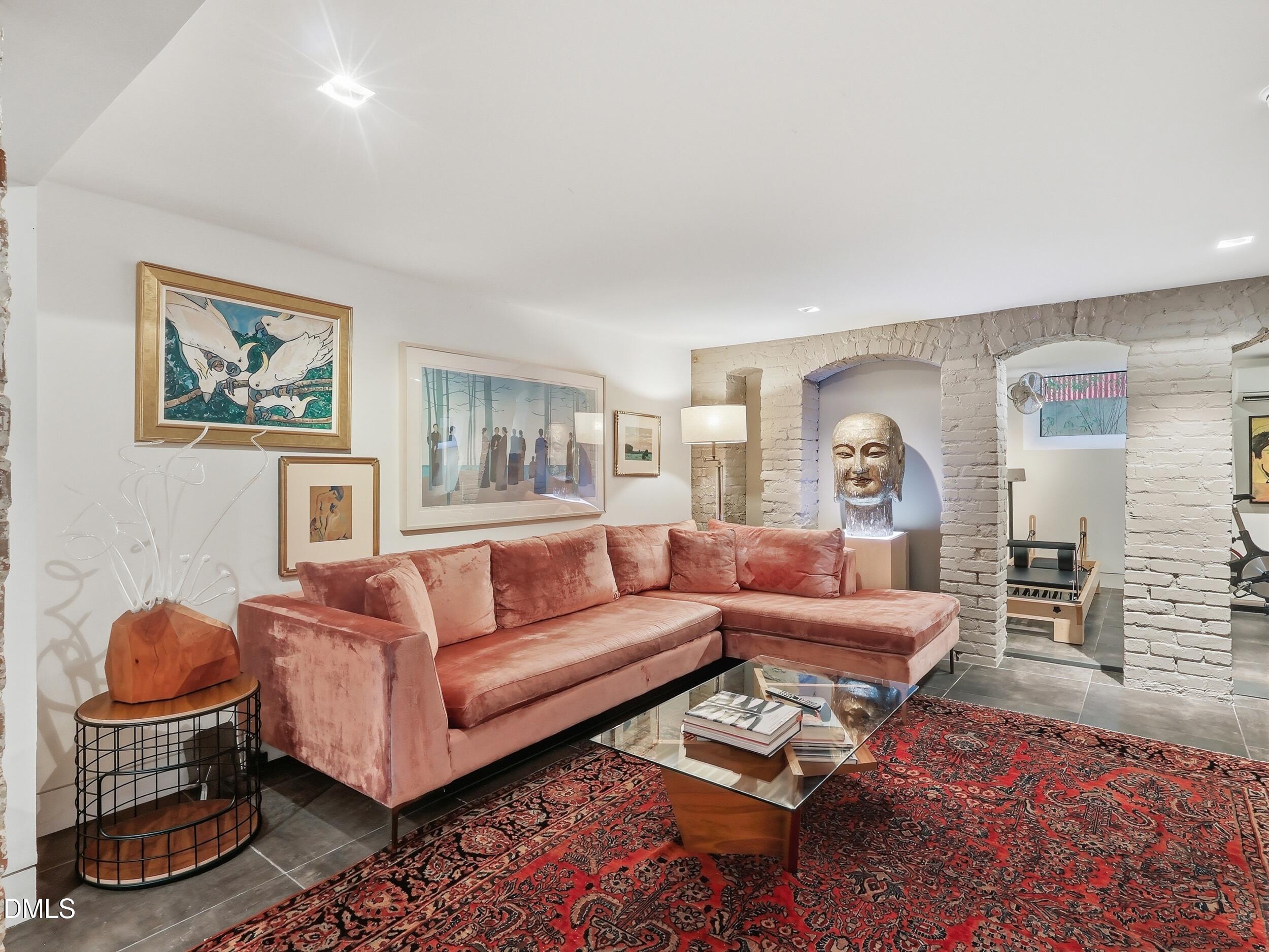 117 Hillcrest Road Raleigh, NC 27605 - Photo 55 of 80 a living room with furniture a rug and a table