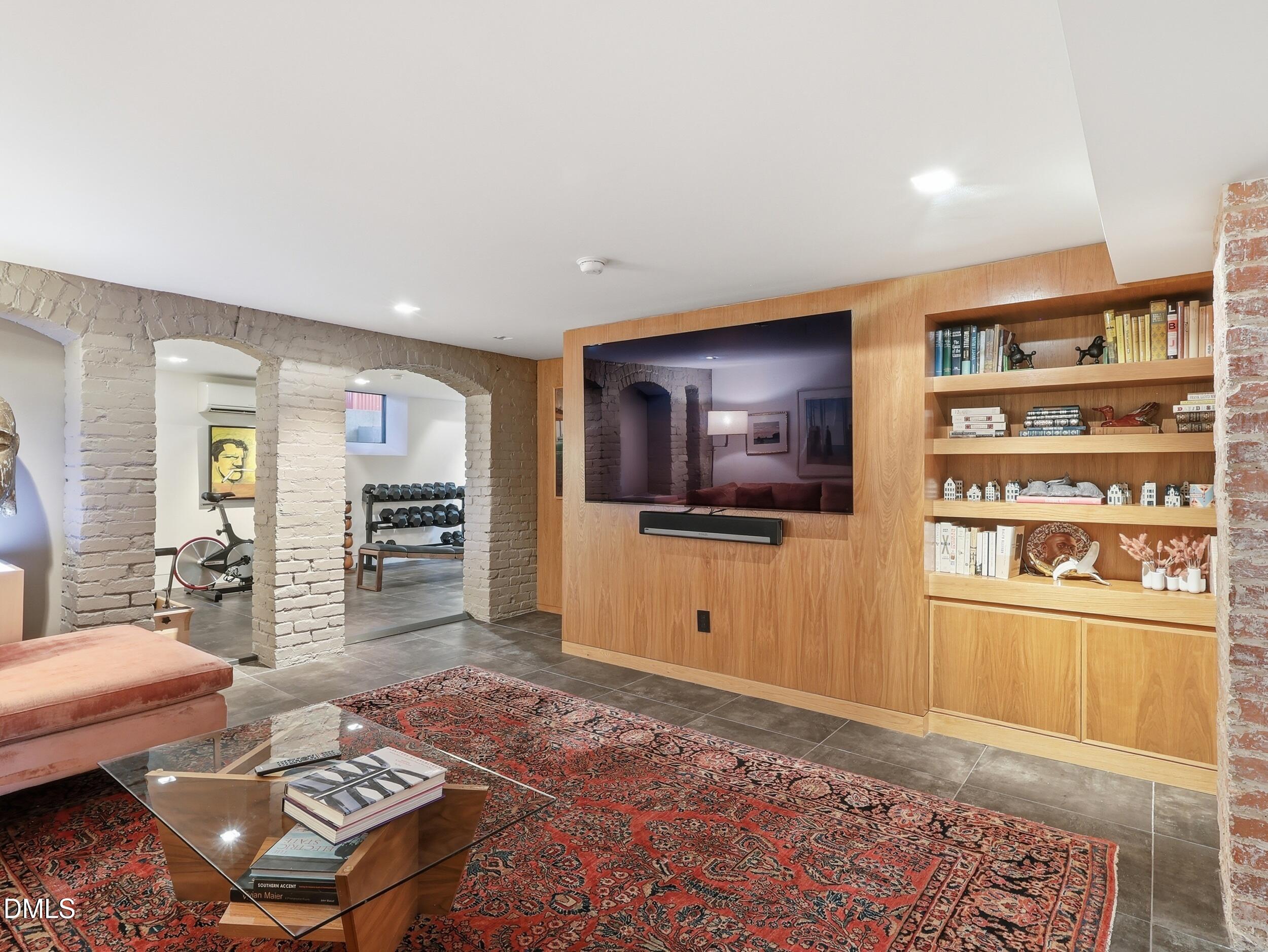 117 Hillcrest Road Raleigh, NC 27605 - Photo 57 of 80 a living room with furniture and a flat screen tv