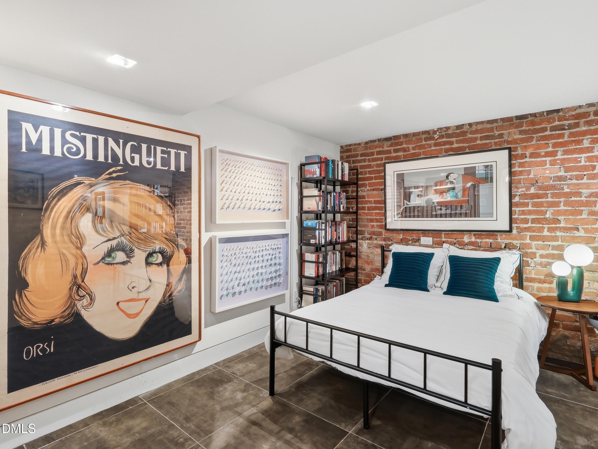 117 Hillcrest Road Raleigh, NC 27605 - Photo 58 of 80 a bedroom with a bed and painting on the wall