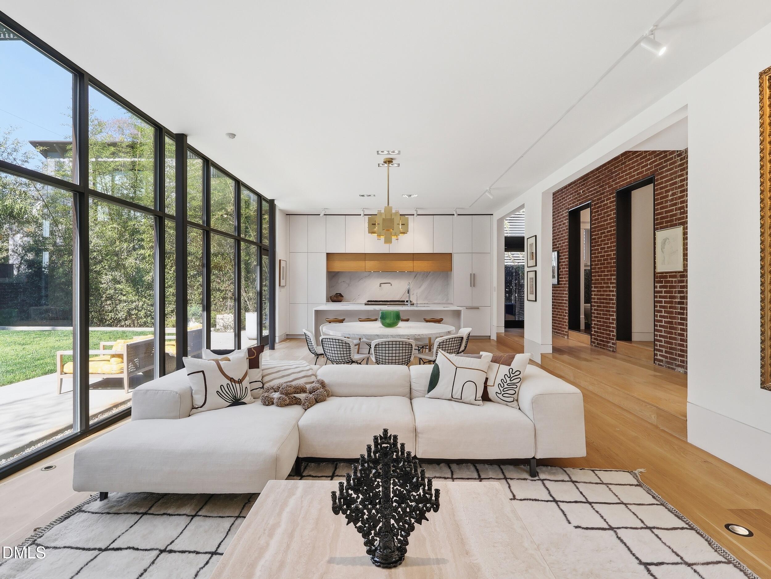 117 Hillcrest Road Raleigh, NC 27605 - Photo 6 of 80 a living room with furniture and a large window