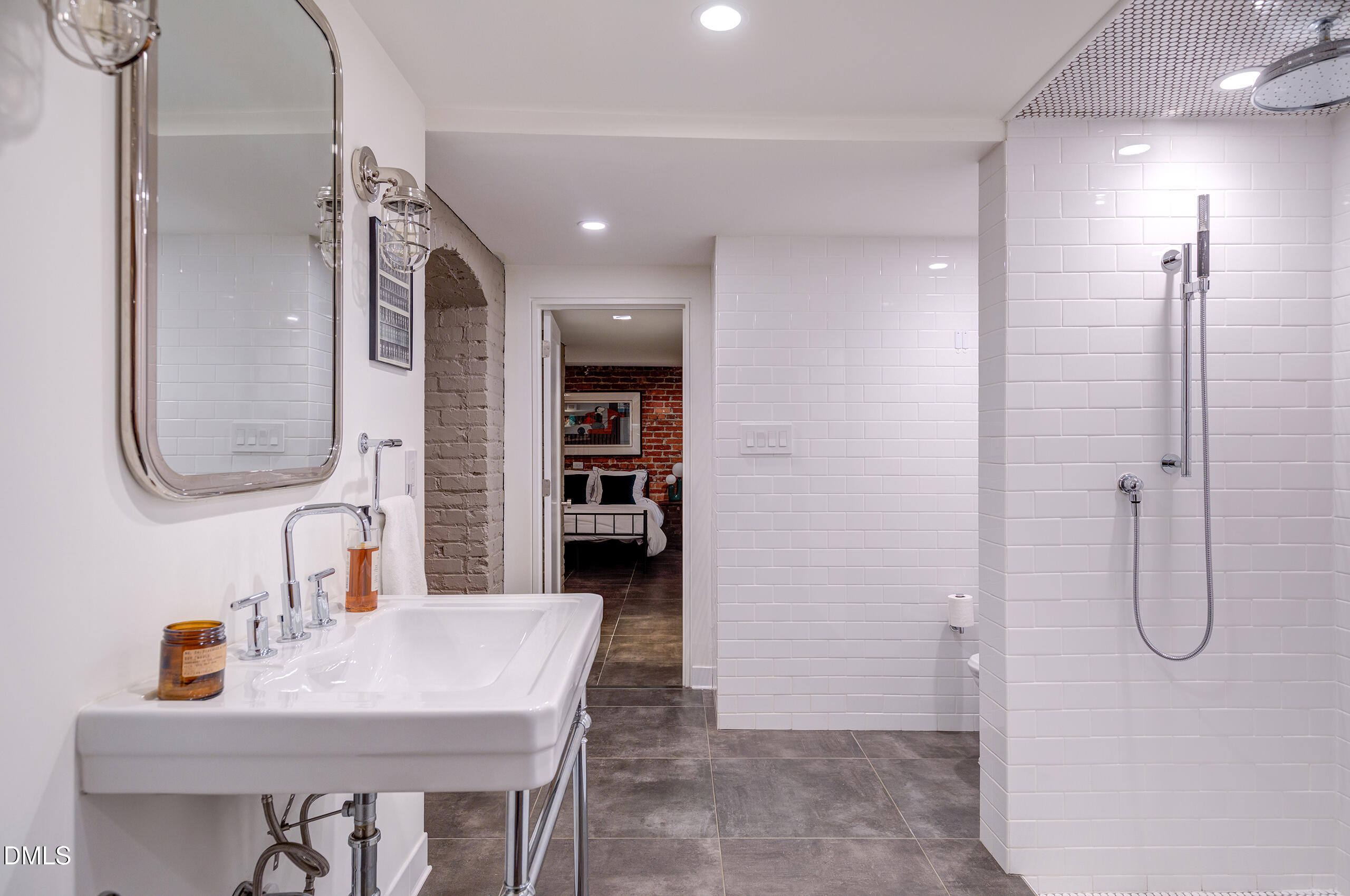 117 Hillcrest Road Raleigh, NC 27605 - Photo 63 of 80 a en suite bathroom with a granite countertop sink and a mirror