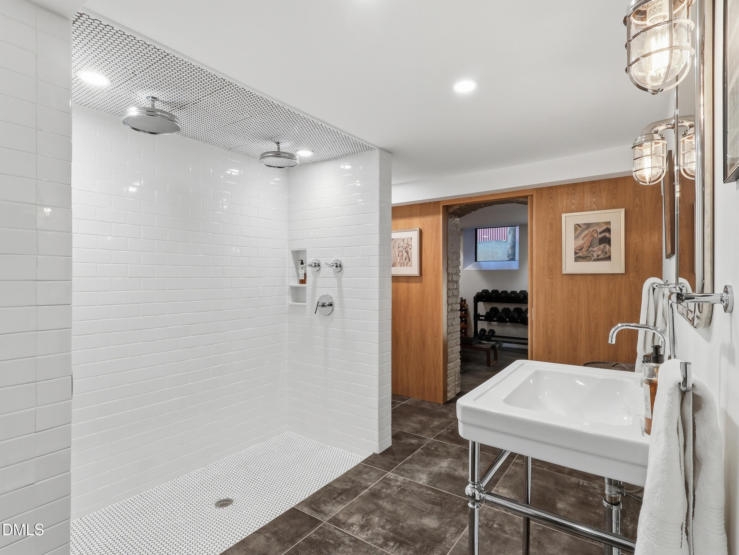 117 Hillcrest Road Raleigh, NC 27605 - Photo 64 of 80 a bathroom with a sink a mirror and a shower