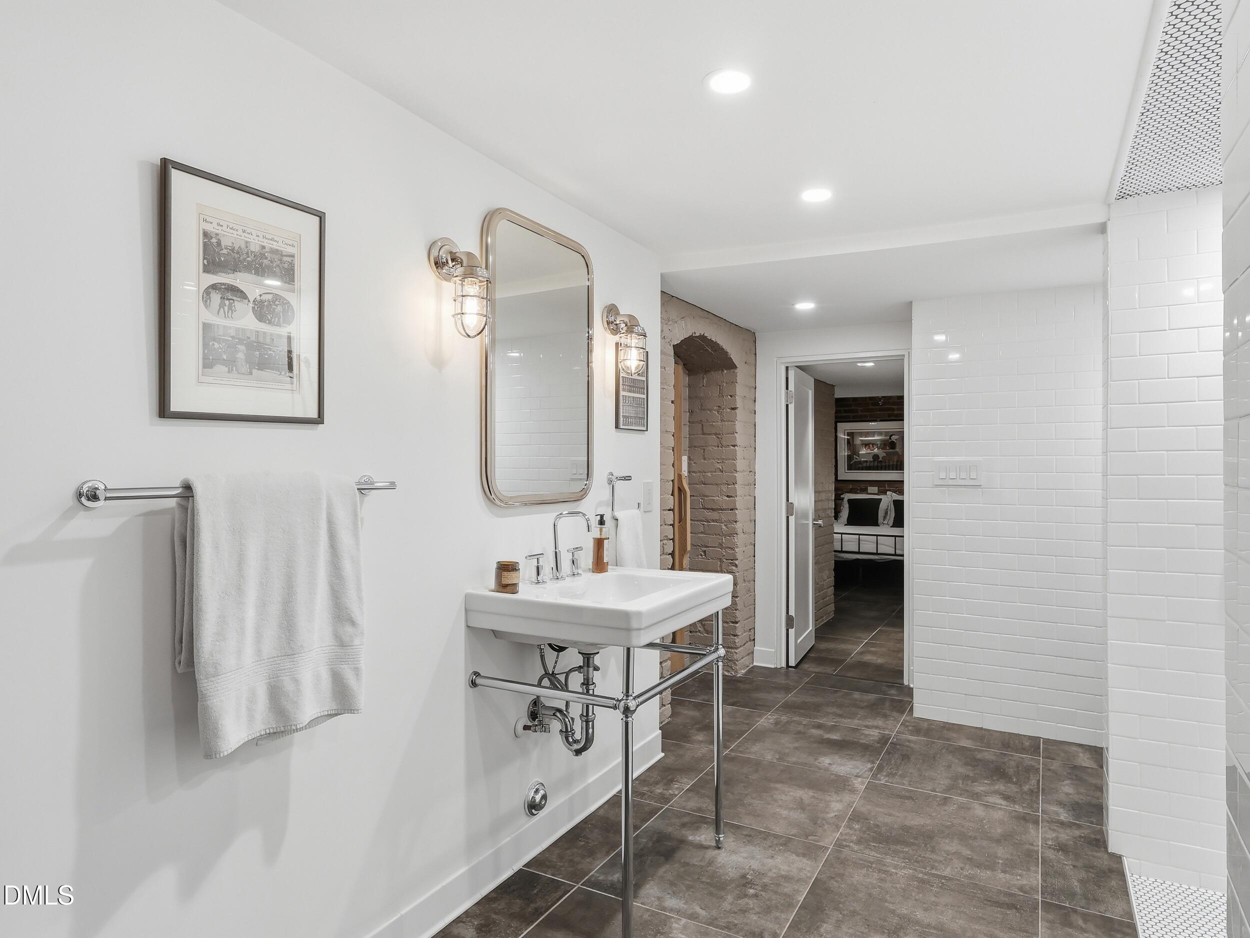 117 Hillcrest Road Raleigh, NC 27605 - Photo 65 of 80 a spacious bathroom with a double vanity sink and a mirror