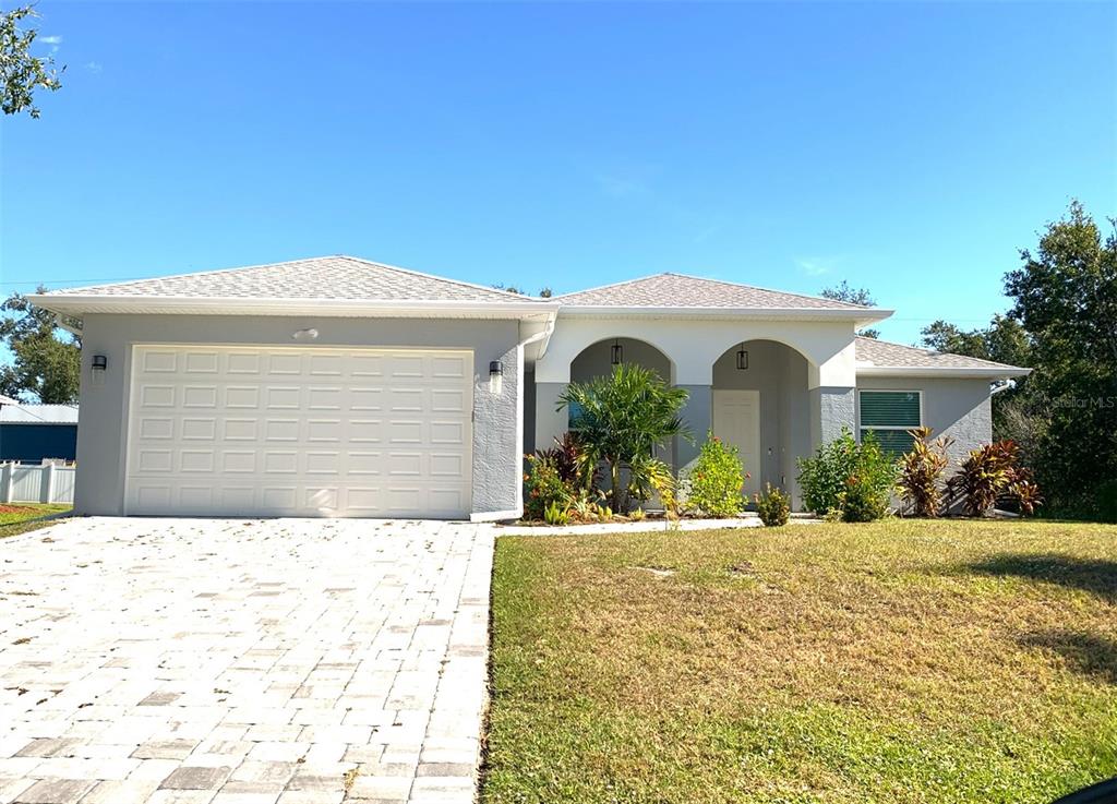 7410 Ellis Lane Port Charlotte, FL 33981 - Photo 1 of 23 a front view of a house with a yard
