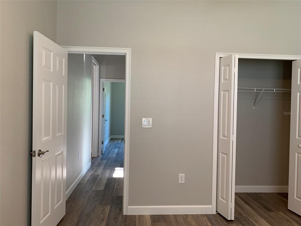 7410 Ellis Lane Port Charlotte, FL 33981 - Photo 11 of 23 a view of a hallway with wooden floor
