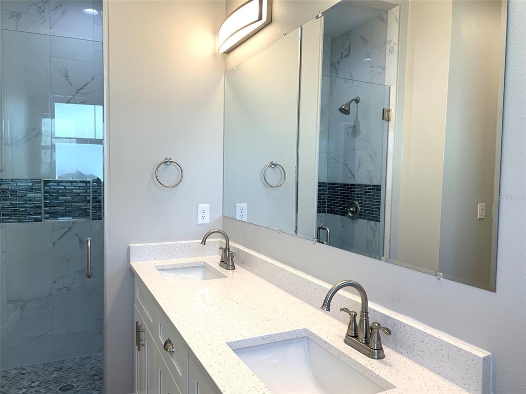 7410 Ellis Lane Port Charlotte, FL 33981 - Photo 13 of 23 a bathroom with a sink and a mirror