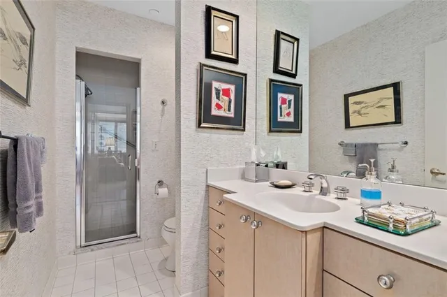 a bathroom with a sink double vanity and shower