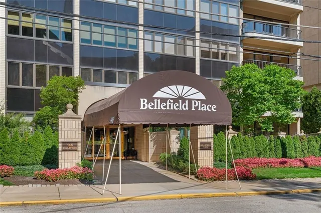 a view of a building with a tree