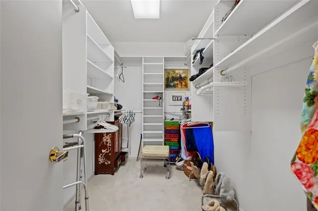 a view of gym equipment with clothes and shoes