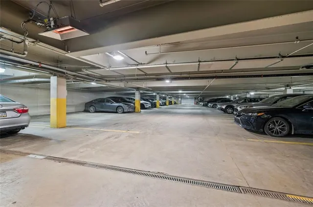 a view of parking garage with cars