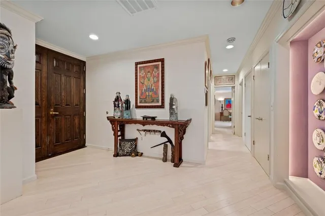 a view of a hallway with seating area