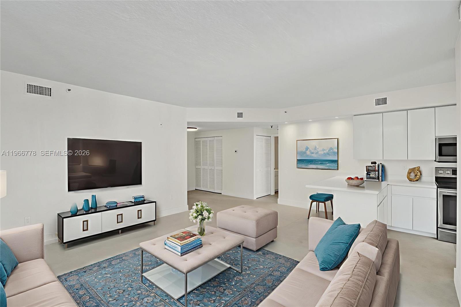 a living room with furniture and a flat screen tv