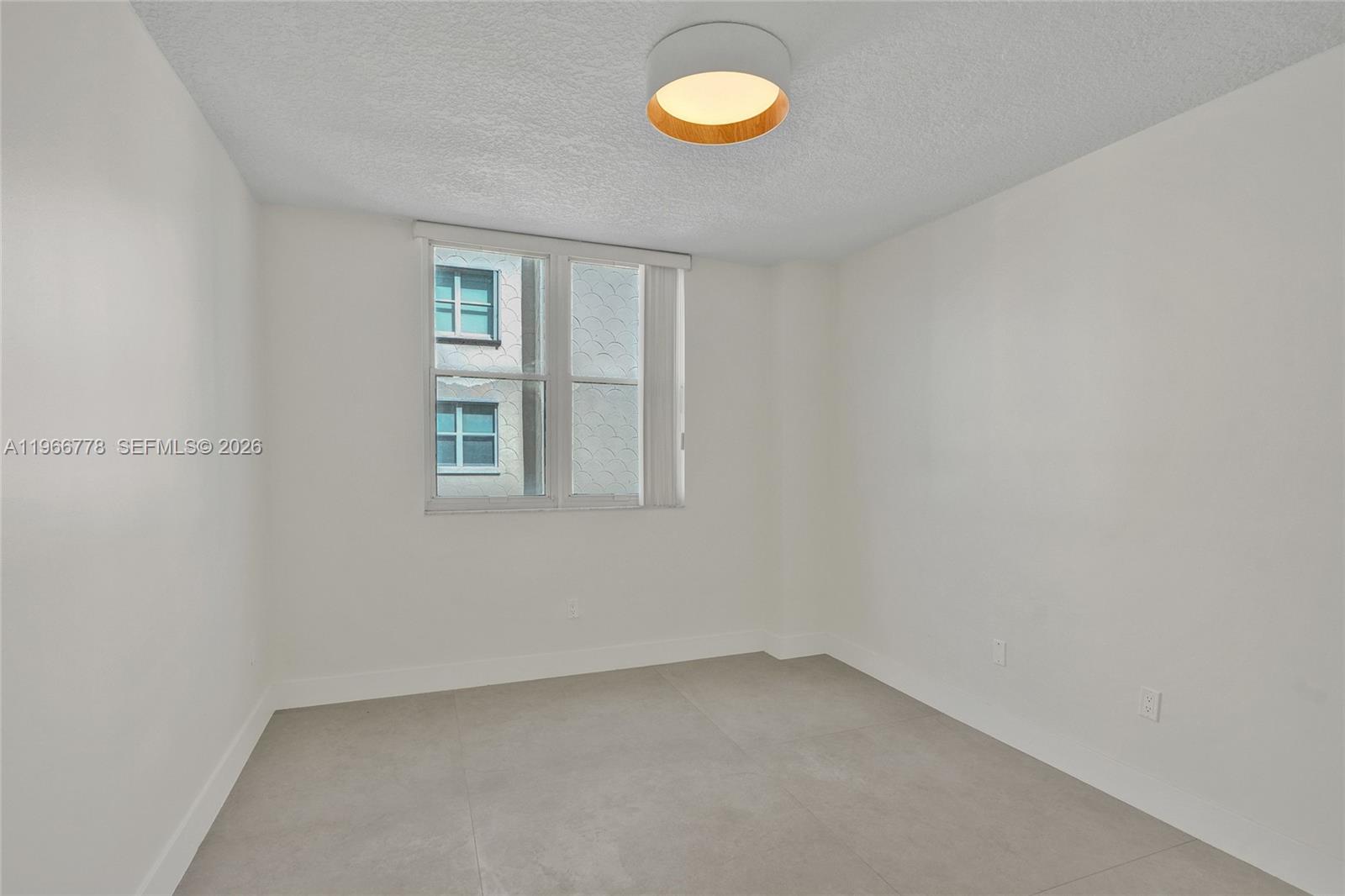 1834 Brickell Avenue, Unit 31 Miami, FL 33129 - Photo 19 of 35 an empty room with a window