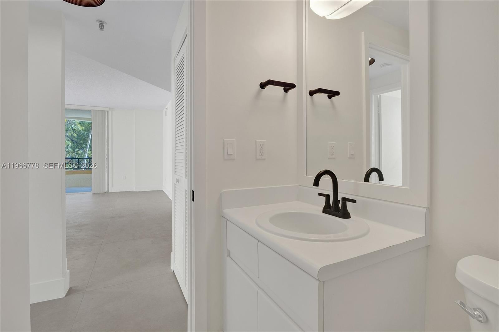 1834 Brickell Avenue, Unit 31 Miami, FL 33129 - Photo 20 of 35 a bathroom with a sink and a toilet