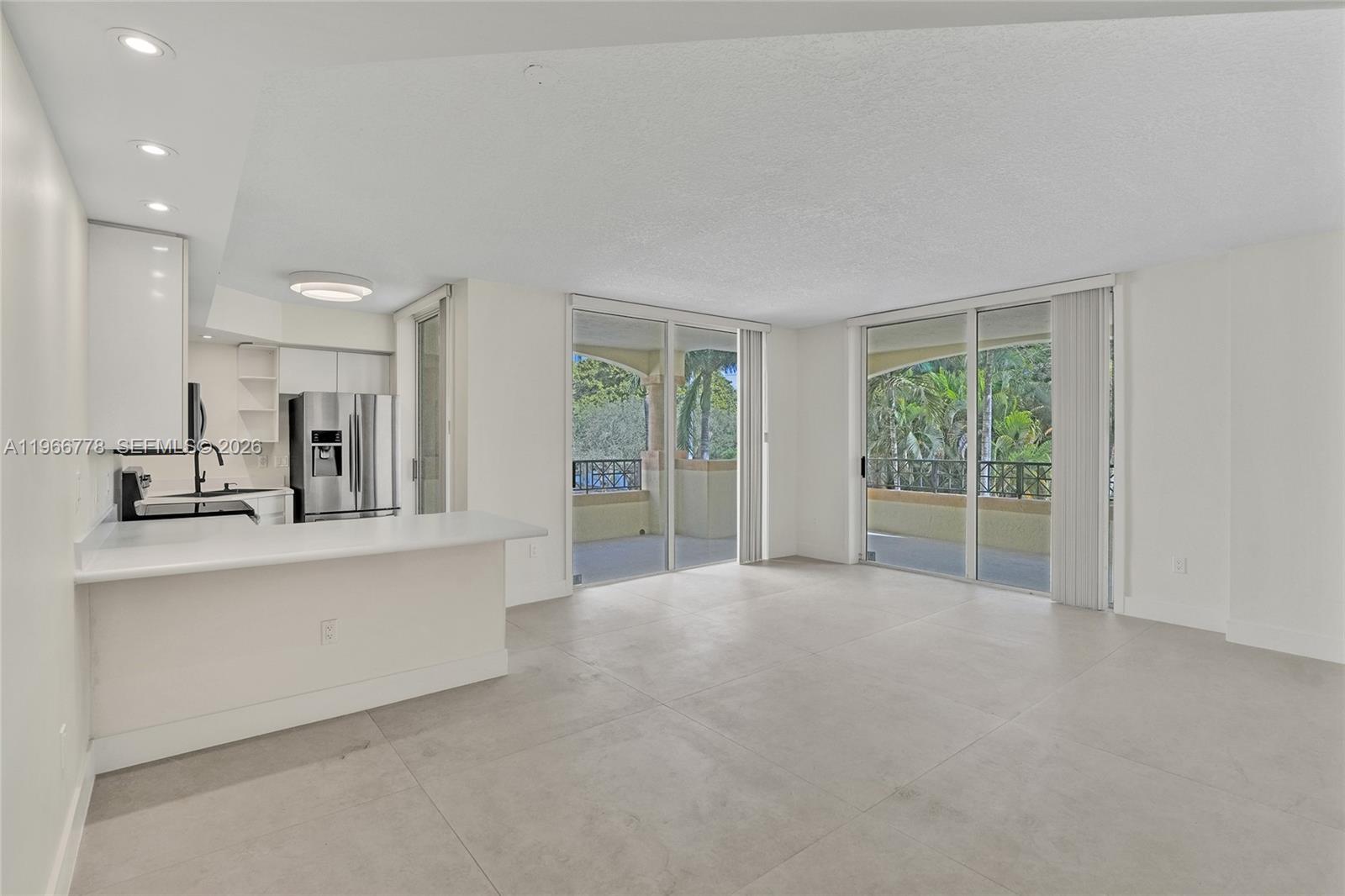 1834 Brickell Avenue, Unit 31 Miami, FL 33129 - Photo 2 of 35 a view of kitchen with furniture and large windows