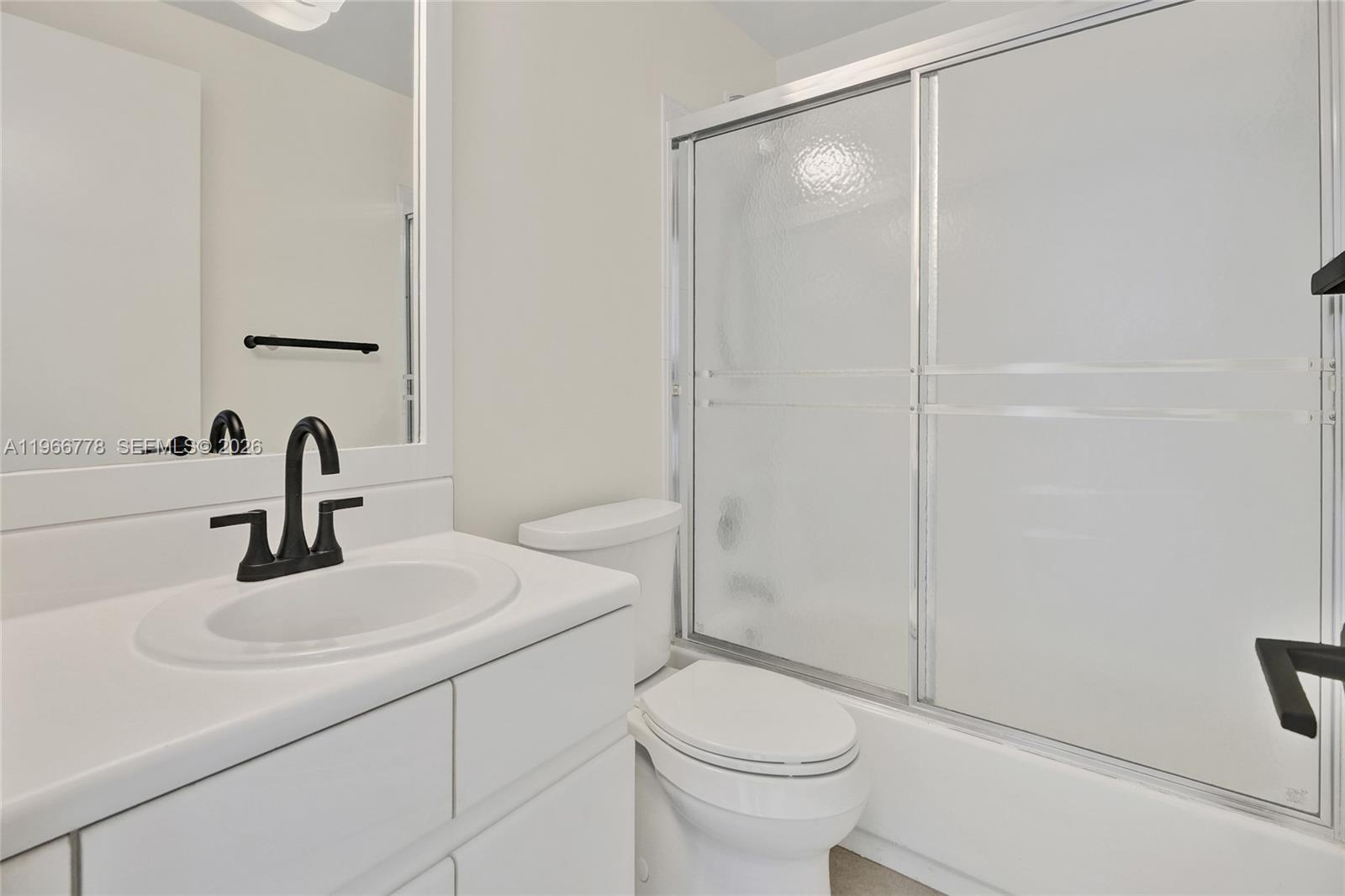 1834 Brickell Avenue, Unit 31 Miami, FL 33129 - Photo 21 of 35 a bathroom with a sink a toilet and shower