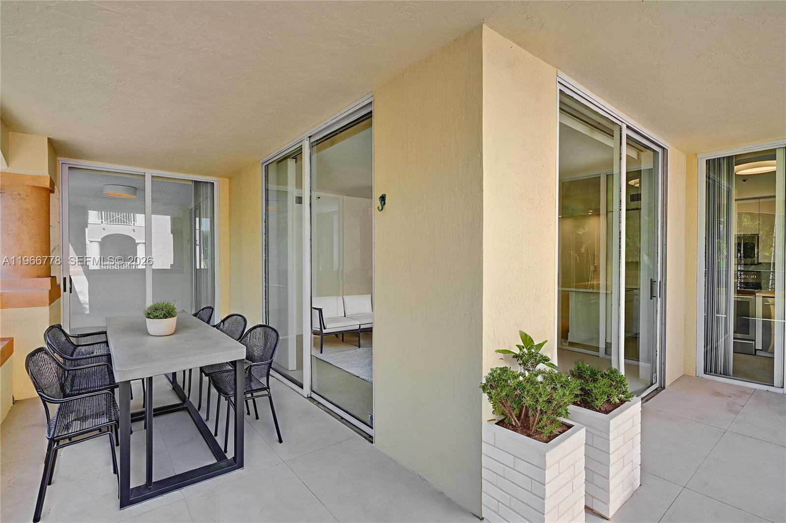 1834 Brickell Avenue, Unit 31 Miami, FL 33129 - Photo 24 of 35 a view of a livingroom with furniture and front door