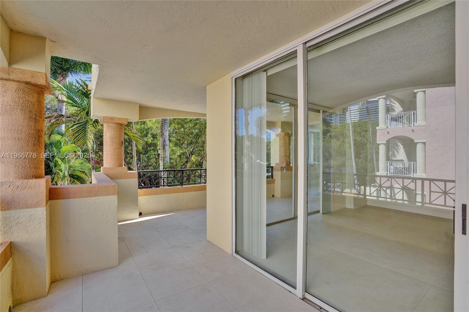 1834 Brickell Avenue, Unit 31 Miami, FL 33129 - Photo 25 of 35 a living room with furniture and windows