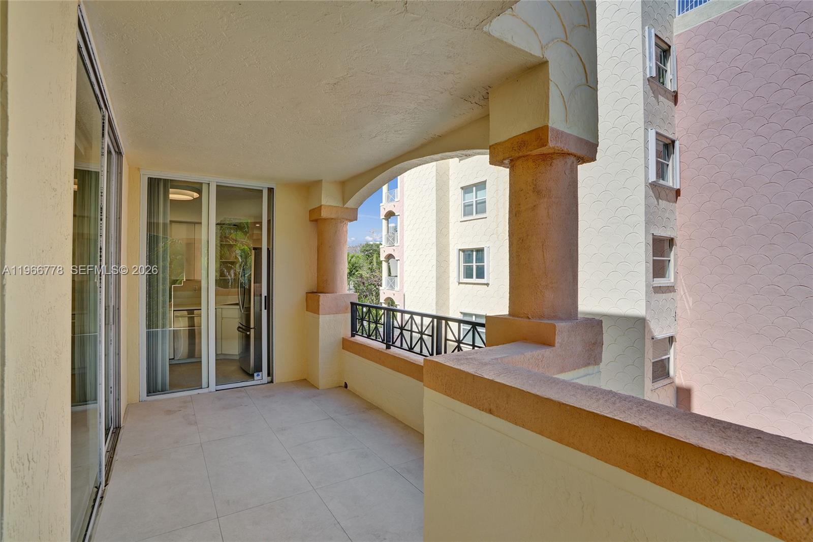 1834 Brickell Avenue, Unit 31 Miami, FL 33129 - Photo 28 of 35 a spacious bedroom with a bed and a large window