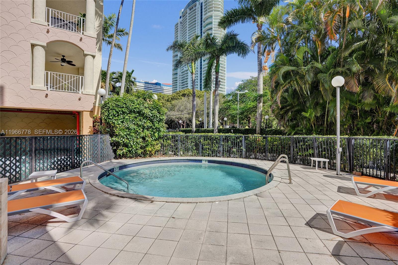 1834 Brickell Avenue, Unit 31 Miami, FL 33129 - Photo 30 of 35 a view of swimming pool with lounge chair