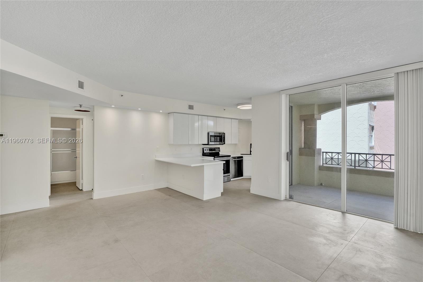 1834 Brickell Avenue, Unit 31 Miami, FL 33129 - Photo 3 of 35 a view of kitchen with refrigerator and window