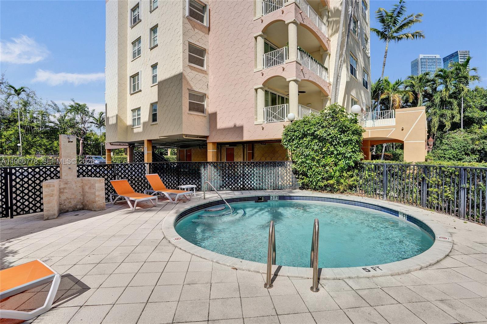 1834 Brickell Avenue, Unit 31 Miami, FL 33129 - Photo 31 of 35 a view of a swimming pool with sitting area
