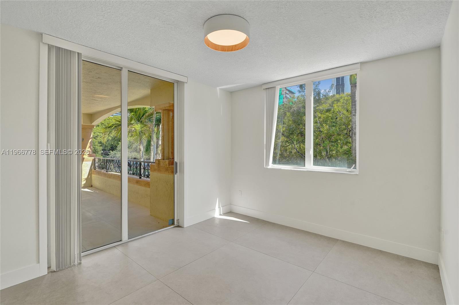 1834 Brickell Avenue, Unit 31 Miami, FL 33129 - Photo 9 of 35 a view of a room with a large window