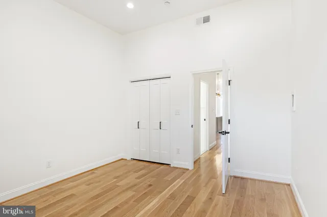 a view of room with wooden floor