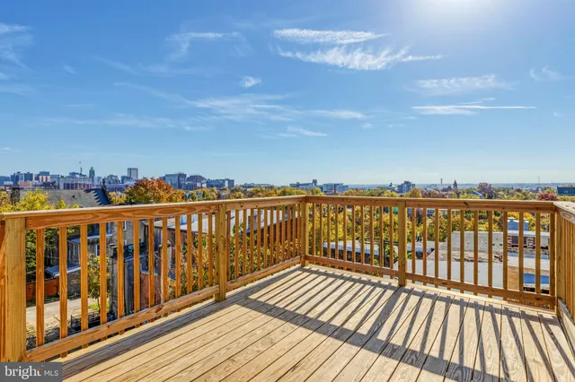 a view of wooden balcony with city view