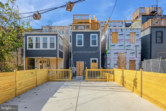 a view of a building with a sink and bench